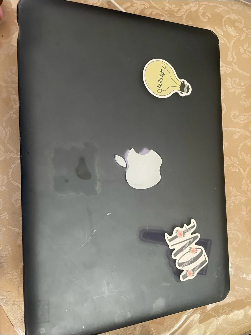 Apple MacBook Pro Silver with Black Keyboard and Sticker